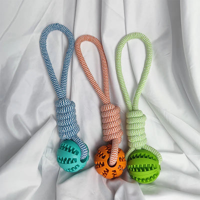 Blue and white braided rope dog toy with a teal rubber treat-dispensing ball for chewing and teeth cleaning. - Image 21