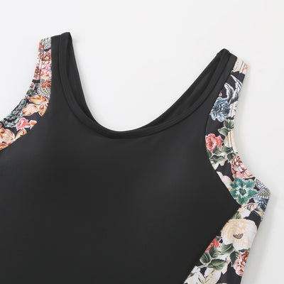 Black one-piece women's swimsuit with colorful floral side panels and boy shorts style bottom. - Image 20