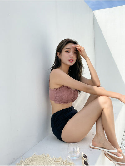 Women's retro high-waisted split bikini with a pink shirred bandeau top and black ruched bottoms. - Image 26