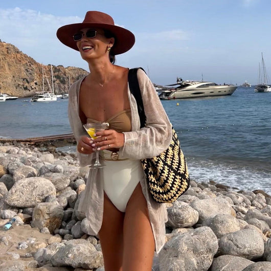 Pink, black, and dark gray color-block one-piece swimsuit with gold round buckles and a sheer black maxi skirt. - Image 39