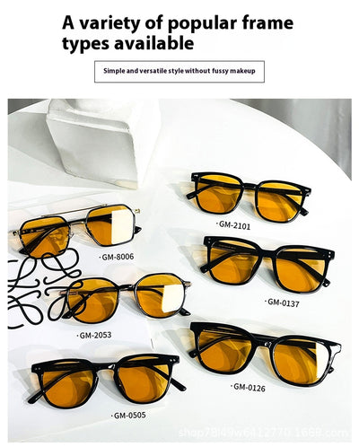 Black full-frame sunglasses with brown lenses, featuring a boxy style and visible dimensions. - Image 31