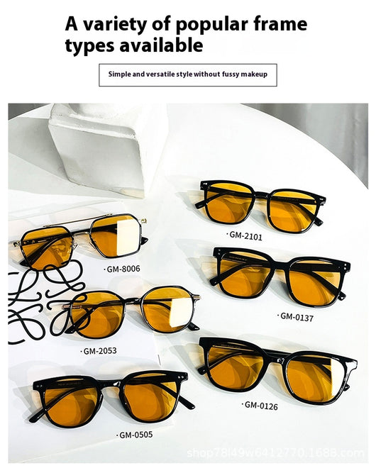 Black full-frame sunglasses with brown lenses, featuring a boxy style and visible dimensions. - Image 31