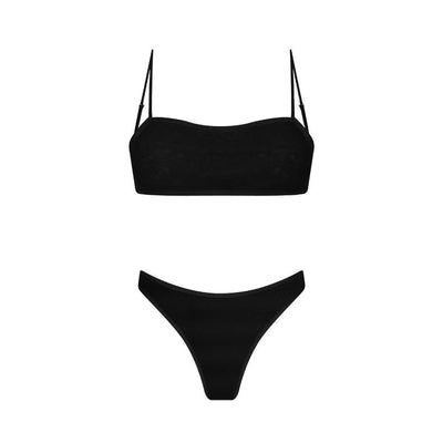 Woman in a blue banded bikini with a circular pattern standing on a sandy beach with clear water and green hills. - Image 34