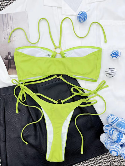 Women's neon green split bikini with lace-up triangle top and bottom, featuring gold O-rings and ruched details. - Image 11