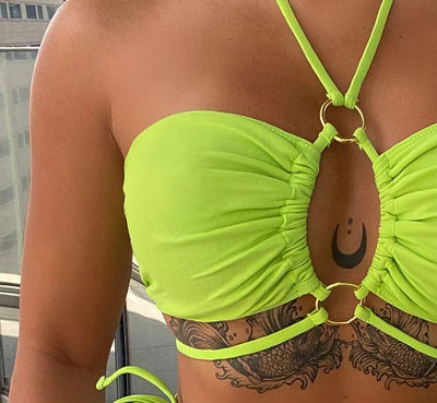Women's neon green split bikini with lace-up triangle top and bottom, featuring gold O-rings and ruched details. - Image 12