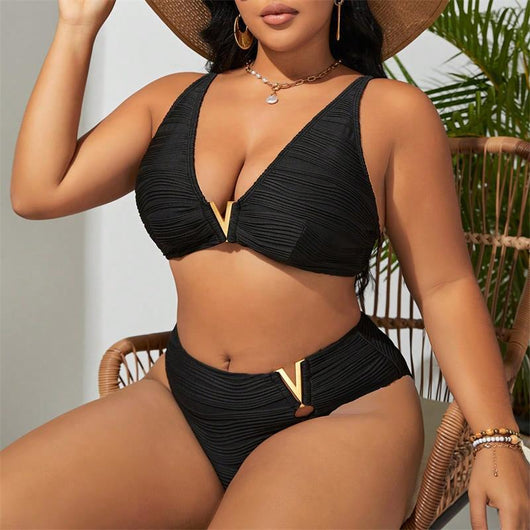 Plus size woman in a black textured two-piece bikini with gold V-shaped hardware. The top is a plunge style, and the bottoms are high-waisted. - Image 16