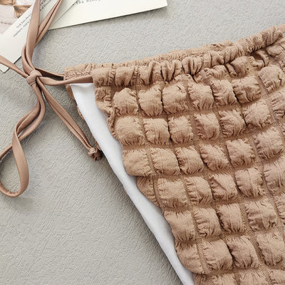 Light brown seersucker three-piece bikini swimsuit with a lace-up triangle top, tie-side bottoms, and a matching wrap skirt. - Image 13