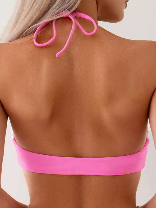 Light pink lace crochet halter bikini with hot pink ties, featuring a floral pattern, worn by a woman. - Image 20