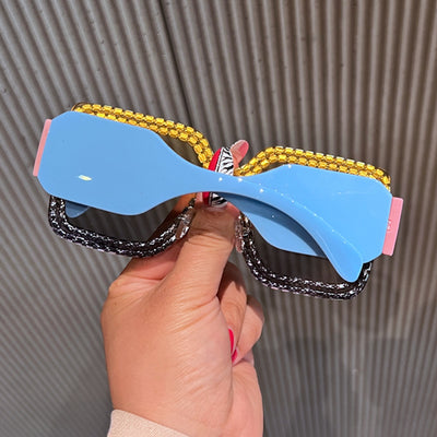 Oversized rectangular sunglasses with black lenses and frames heavily embellished with multiple rows of sparkling rhinestones. - Image 16