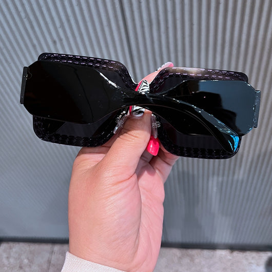 Oversized rectangular sunglasses with black lenses and frames heavily embellished with multiple rows of sparkling rhinestones. - Image 17