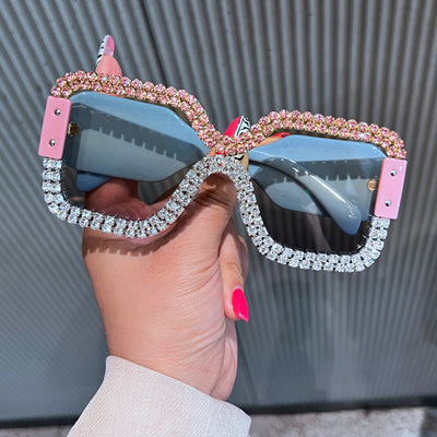 Oversized rectangular sunglasses with black lenses and frames heavily embellished with multiple rows of sparkling rhinestones. - Image 18