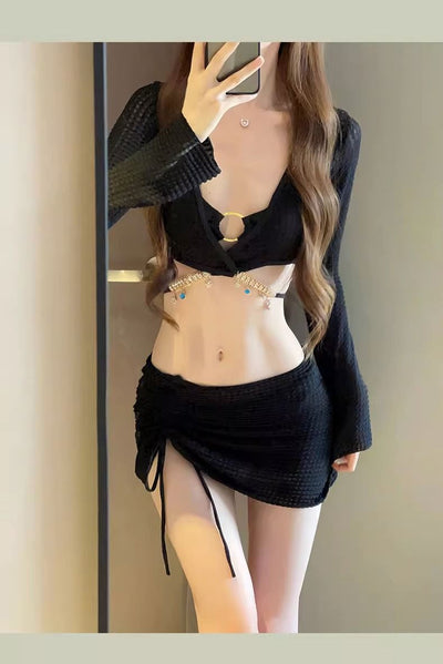 White three-piece bikini swimsuit set with a long-sleeve crop top, bikini top with gold ring, and ruched mini skirt. - Image 23