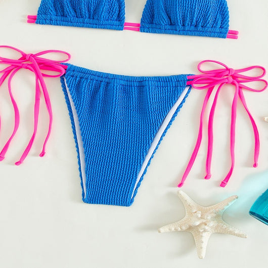 Women's purple textured two-piece swimsuit with light blue lace-up ties, featuring a triangle bikini top and thong bottom. - Image 19