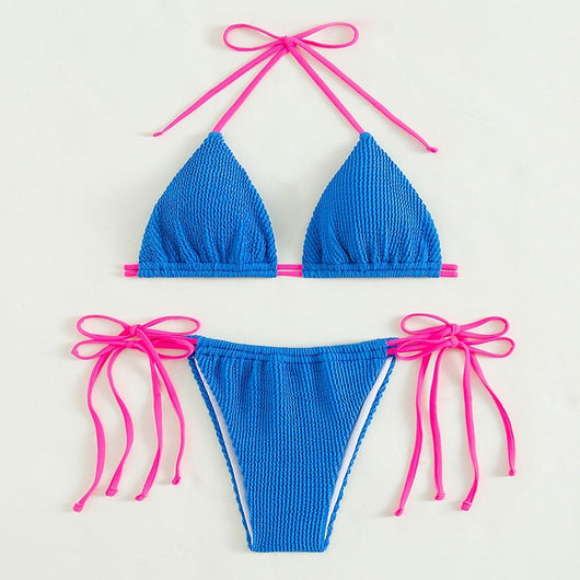 Women's purple textured two-piece swimsuit with light blue lace-up ties, featuring a triangle bikini top and thong bottom. - Image 21