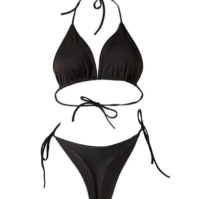 Woman in a bright pink solid color string bikini with a triangle top and T-back bottom, featuring side ties. - Image 13