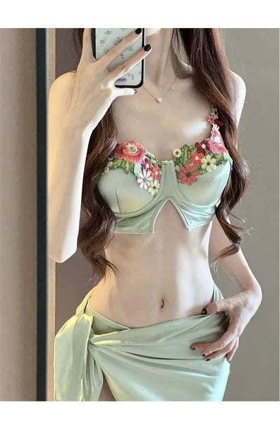 Women's light green three-piece bikini with floral embroidered triangle top, matching bottoms, and a sarong skirt. - Image 23