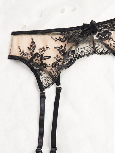 Nude and black embroidered sheer lingerie set with a bra, thong, and garter belt, featuring floral lace. - Image 12
