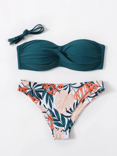 Blue bandeau bikini top with tropical leaf print high-cut bottom, styled with sandals, sunglasses, and a straw hat. - Image 17