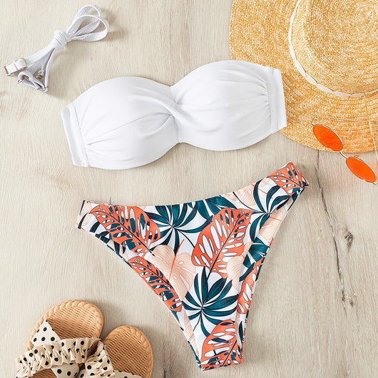 Blue bandeau bikini top with tropical leaf print high-cut bottom, styled with sandals, sunglasses, and a straw hat. - Image 22