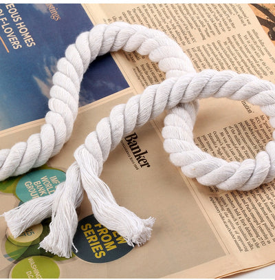Coiled beige three-strand coarse cotton rope, showcasing its natural texture and thickness on a white background. - Image 22