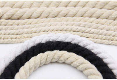 Coiled beige three-strand coarse cotton rope, showcasing its natural texture and thickness on a white background. - Image 27