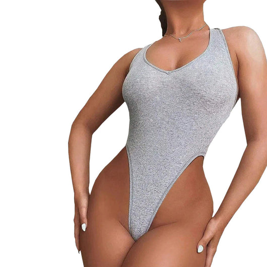 Woman wearing a light grey ribbed halter bodysuit with a deep V-neckline and high-cut leg design. - Image 11