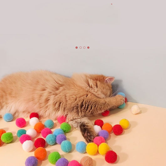 Colorful pompom balls and a yellow and blue toy launcher, a fun set for cats or kids. - Image 27