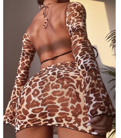 Leopard print three-piece swimsuit set with a halter bikini top, high-cut bottom, mini skirt, and detached long sleeves. - Image 7