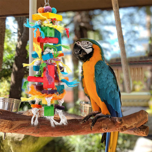 Colorful wooden and rope nibbling toy for parrots, featuring blocks, beads, and knotted ropes, next to a macaw. - Image 18