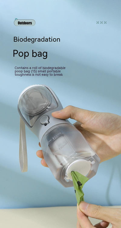 Purple 3-in-1 portable pet water bottle with food compartment, waste bag dispenser, and lanyard. - Image 24