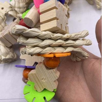Colorful parrot gnawing toy with wooden blocks, woven straw, and plastic beads, hanging from a metal hook. - Image 9