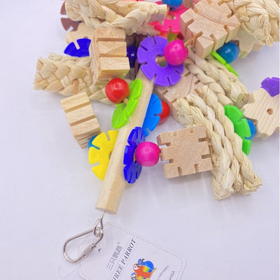 Colorful parrot gnawing toy with wooden blocks, woven straw, and plastic beads, hanging from a metal hook. - Image 11