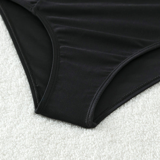 Girls' two-piece bikini swimsuit with a colorful striped crop top and solid black high-waisted ruched bottoms. - Image 17