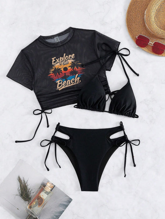 Black three-piece swimsuit with a mesh crop top featuring an "Explore the Beach" graphic, bikini top, and high-waisted bottoms. - Image 66