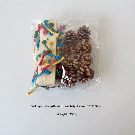 Packaged parrot toy with a wooden block, colorful hemp ropes, and natural pine cones for chewing and play. - Image 16