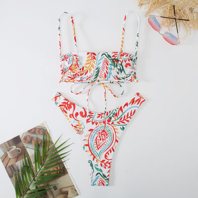 White ribbed two-piece swimsuit with pink and blue paisley floral print, bandeau top, and high-cut bottoms. - Image 19