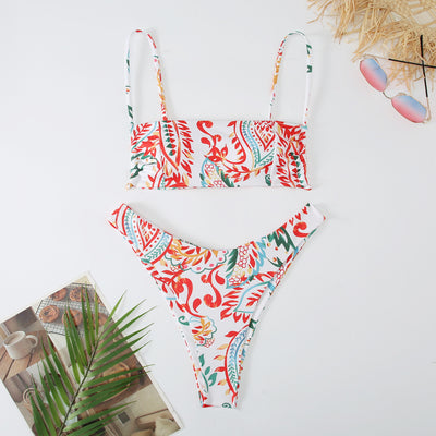 White ribbed two-piece swimsuit with pink and blue paisley floral print, bandeau top, and high-cut bottoms. - Image 21