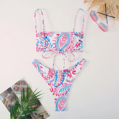 White ribbed two-piece swimsuit with pink and blue paisley floral print, bandeau top, and high-cut bottoms. - Image 22