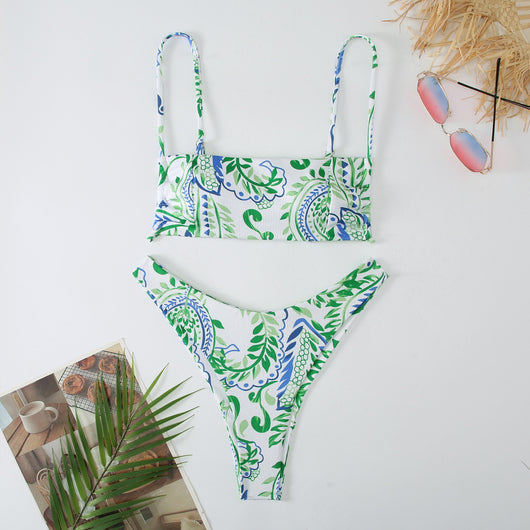 White ribbed two-piece swimsuit with pink and blue paisley floral print, bandeau top, and high-cut bottoms. - Image 26