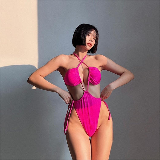 Black drawstring one-piece swimsuit with a ruched halter top and high-cut, tie-side bottom on a woman. - Image 22
