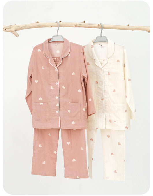 Pink long-sleeved pajama set for children with an all-over cherry print, Peter Pan collar, and matching pants. - Image 11