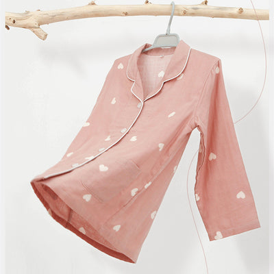 Pink long-sleeved pajama set for children with an all-over cherry print, Peter Pan collar, and matching pants. - Image 14
