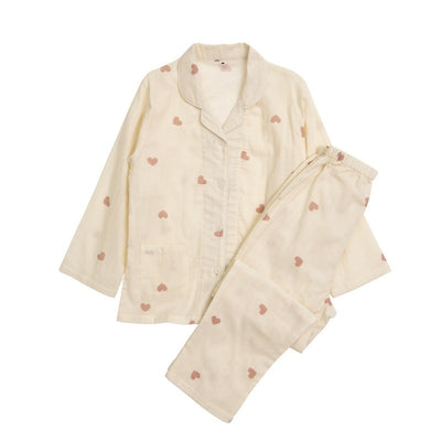 Pink long-sleeved pajama set for children with an all-over cherry print, Peter Pan collar, and matching pants. - Image 19