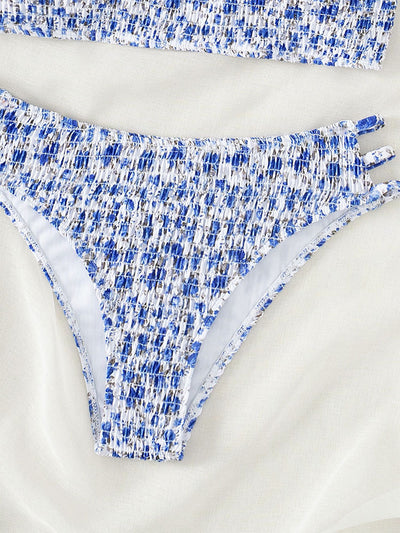 Floral smocked strapless bandeau bikini with high-cut bottoms featuring side straps, in white, teal, and red. - Image 13