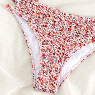 Floral smocked strapless bandeau bikini with high-cut bottoms featuring side straps, in white, teal, and red. - Image 15