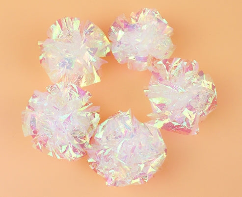 Five iridescent crinkle paper balls, likely cat toys, arranged in a circle on a peach background. - Image 19