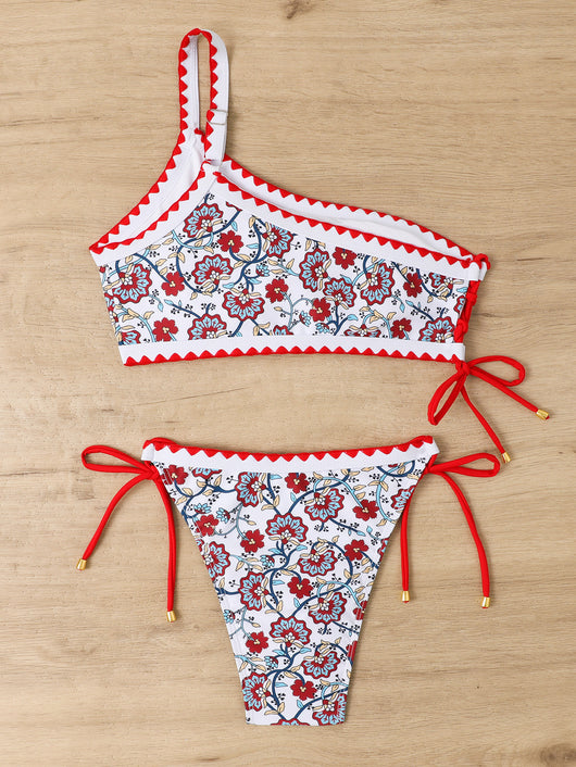 Women's one-shoulder bikini with red and blue floral print on white, featuring red trim and tie-side bottoms. - Image 27