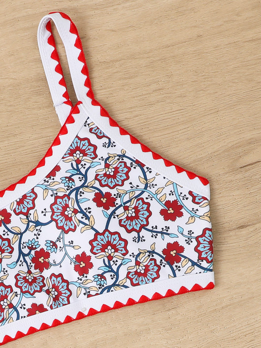 Women's one-shoulder bikini with red and blue floral print on white, featuring red trim and tie-side bottoms. - Image 42