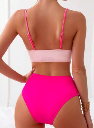 Woman wearing a blue color block split swimsuit with a wrapped front bikini top and high-waisted briefs. - Image 18