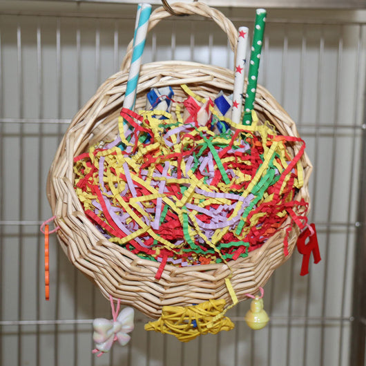 Woven basket bird toy filled with colorful shredded paper, paper tubes, and hanging chewable elements. - Image 10